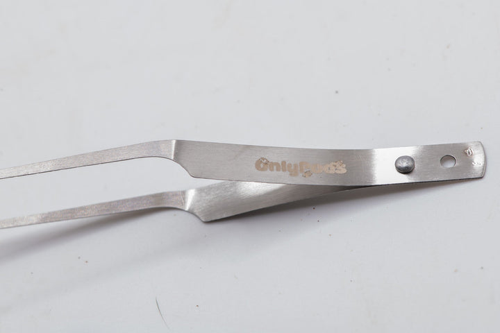 fully silver looking tweezers with onlypods logo in gold on side