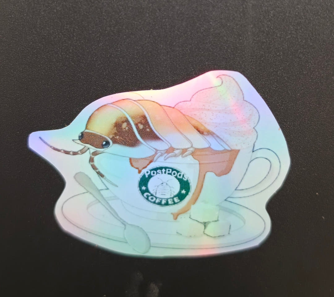 Sticker of an isopod sitting in a cup of coffee topped with cream, the cup carrying a green PostPods Coffee logo.