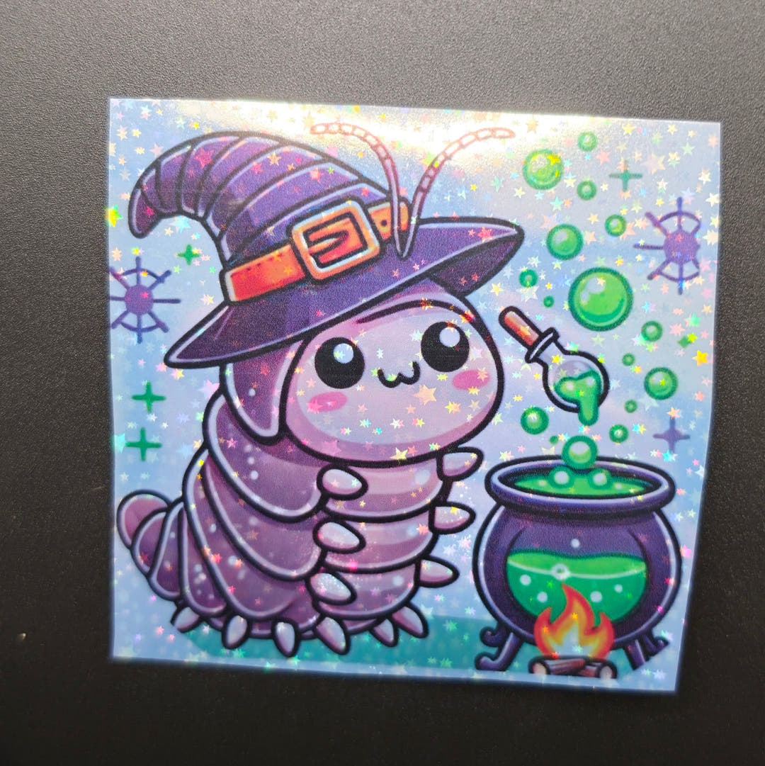 A square glittery sticker of a purple isopod in a witch hat beside a bubbling green cauldron.