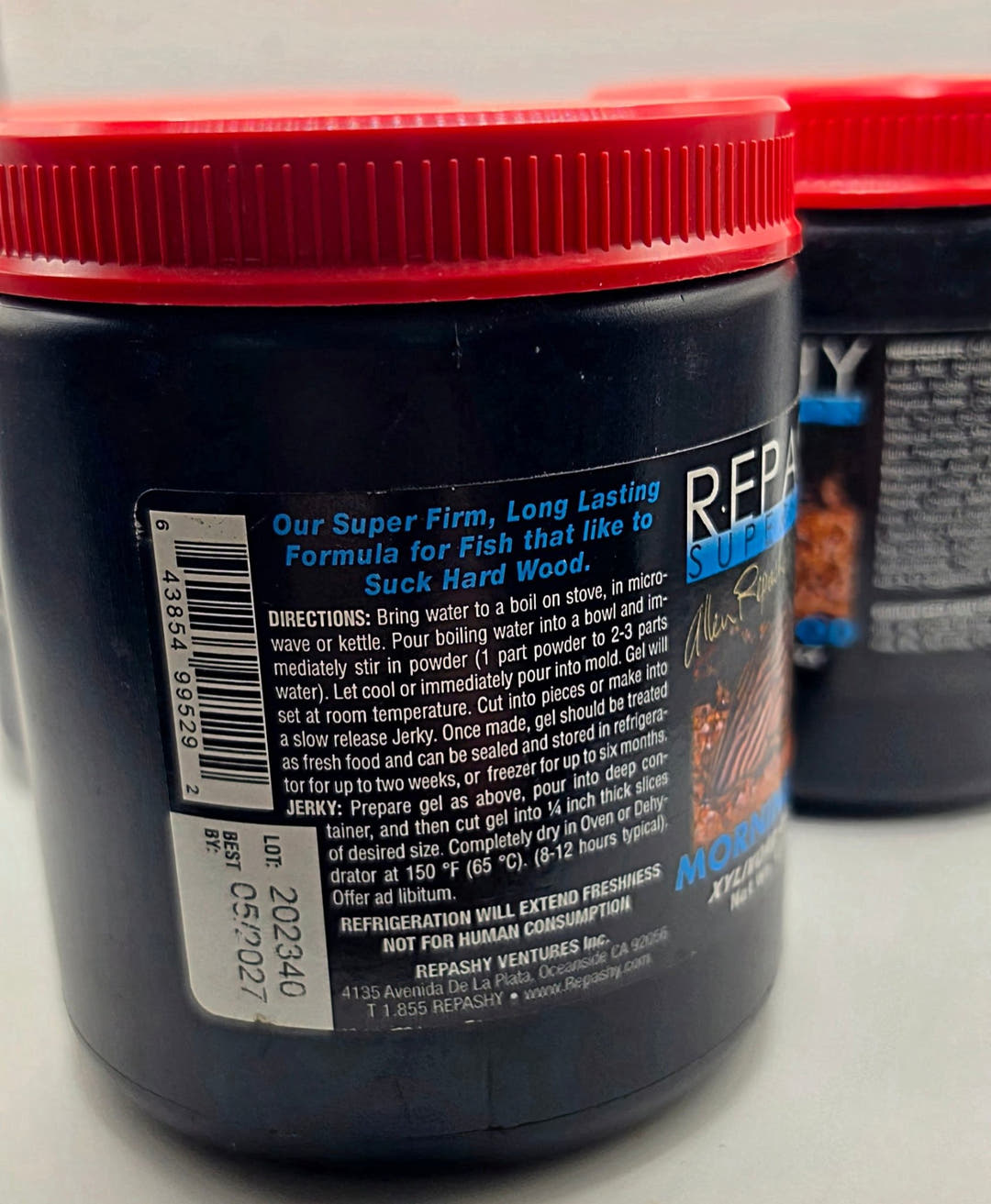 Rear of a Repashy Morning Wood tub showing the directions text, barcode and a printed lot and date sticker.